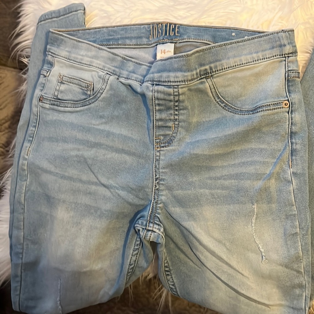 Girls Tween distressed denim legging.